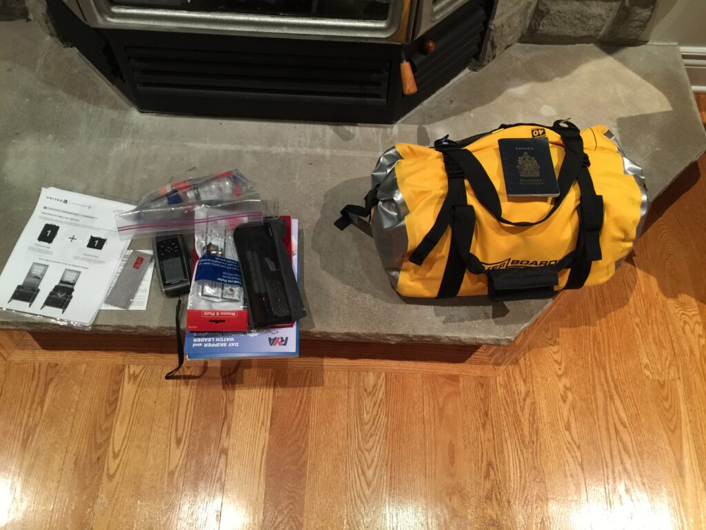 The yellow water bag is my husband's only luggage. It contains all of jhis gear, except what you straggling about on the left