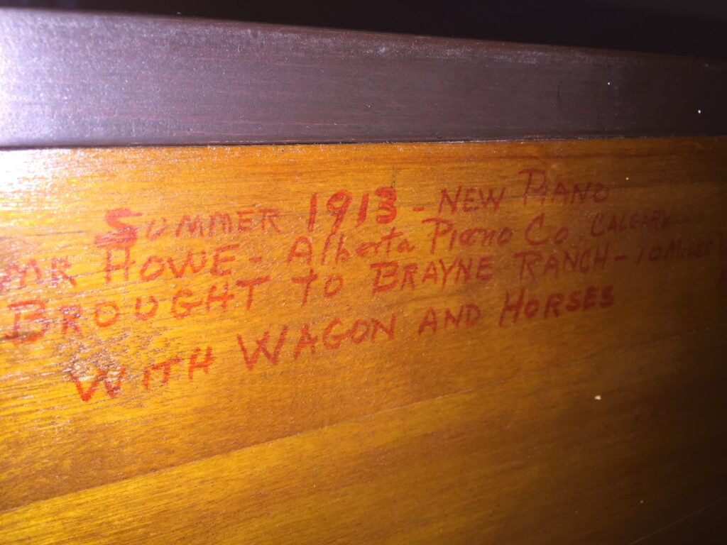 Downsizing for a sailing life: Inscription on our upright piano.