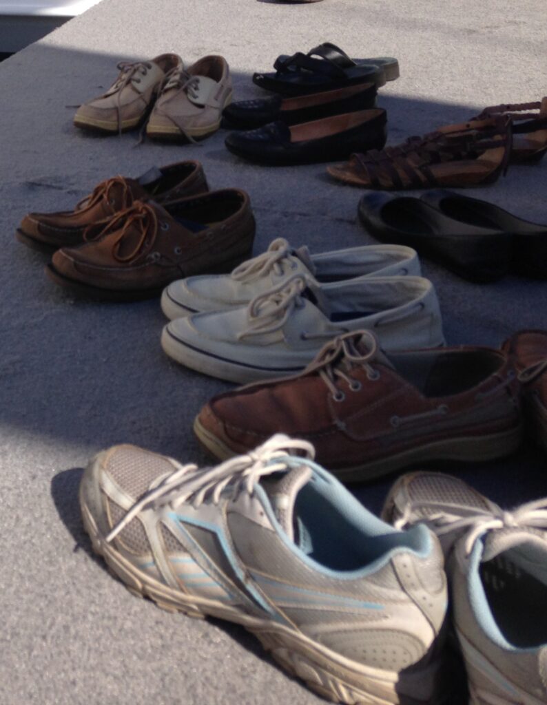 Annapolis Boat Show for Beginners: Photo of Shoes at the Annapolis Boat Shoes. All of the shoes are slip-ons except those of the first-time attendee, and writer.