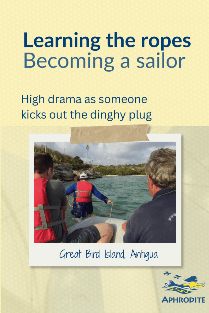 A photo of participants from a Competent Crew RYA course at Great Bird Island, Antigua after bailing a dinghy, attempting to self rescue, not realizing our instructor had kicked out the dinghy plug.