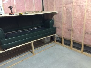 Couch is in place. Here we tested our marriage by carrying heavy objects together.