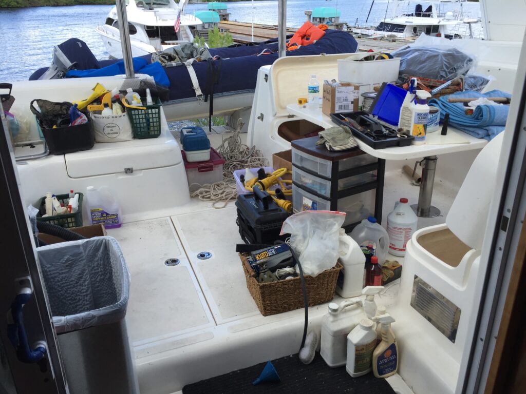 Boat Organization: Spares, tools and chemicals litter the cockpit as we try to determine what is garbage and what can be kept.