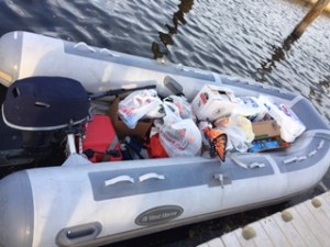 Dinghy loaded with the equivalent of three grocery carts' worth of stuff.