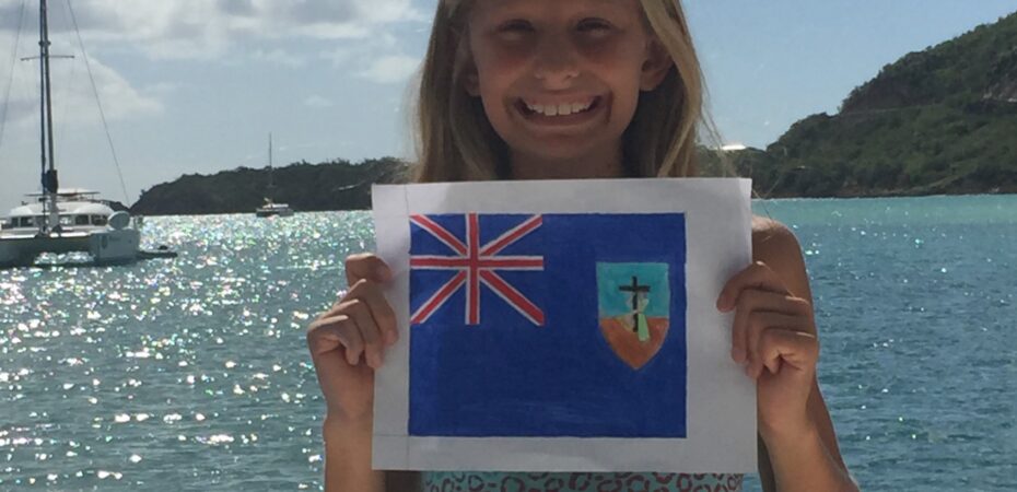 Writer of the Grade 6 Essay Sample, Betty with her hand-drawn Montserrat flag. Later, she laminated the flag and we flew it on our boat,, SV Aphrodite.