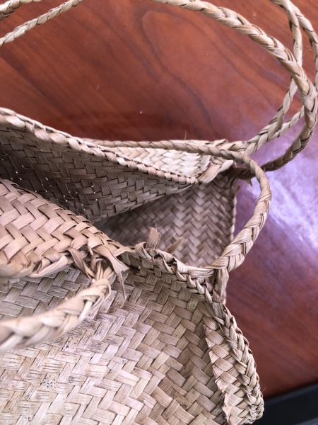A woven bag made in Jorth Pentacost Island, Vanuatu, torn due to a mugging in Honiara, Solomon Islands. The weave of the bag is region-specific.