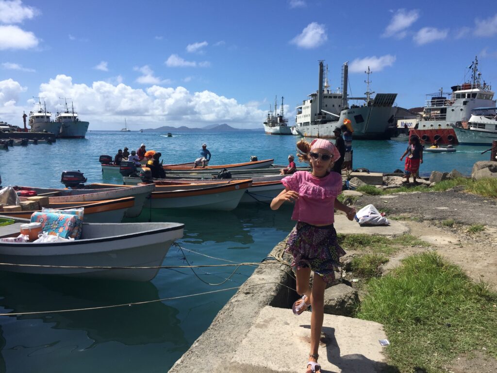 Teen independence run amok on the dock in Chuuk, Micronesia as we head to shore to buy diesel.