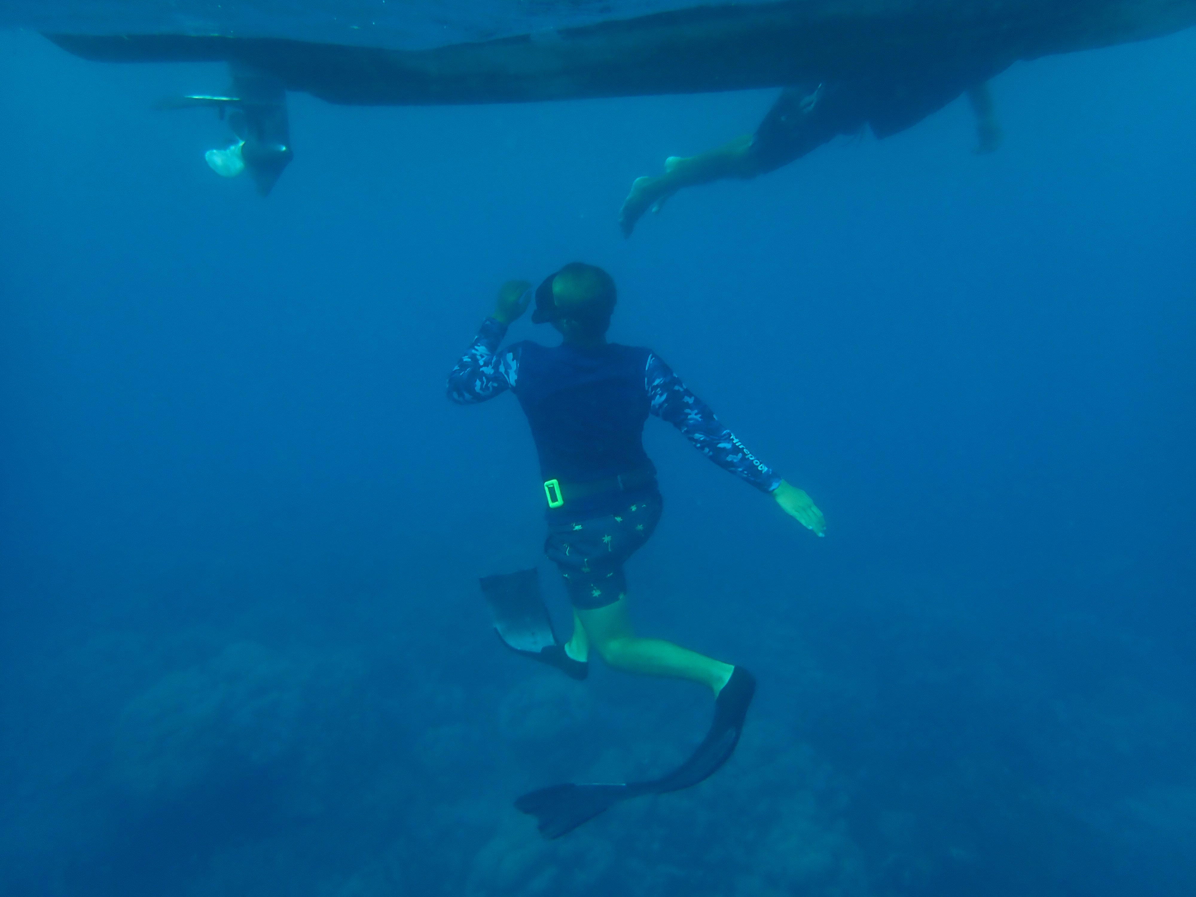 Underwater photo of dinghy with Paul and Rick