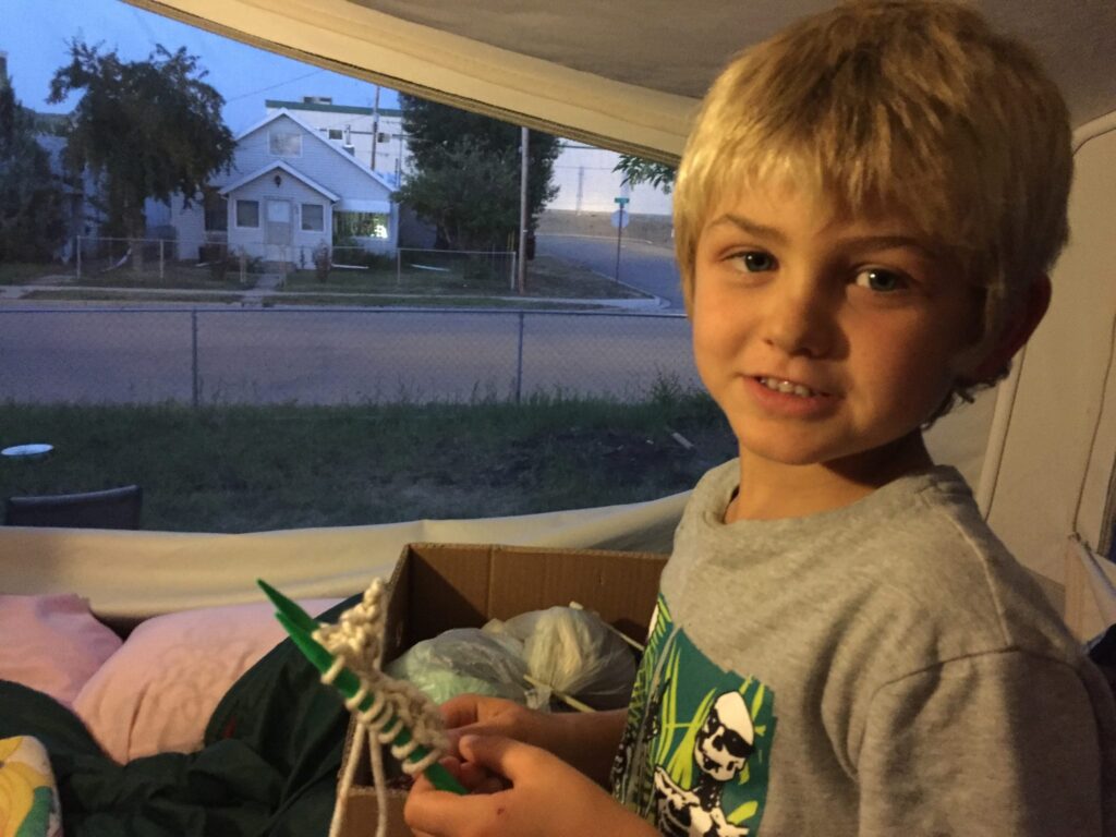 Henry knitting, age 7