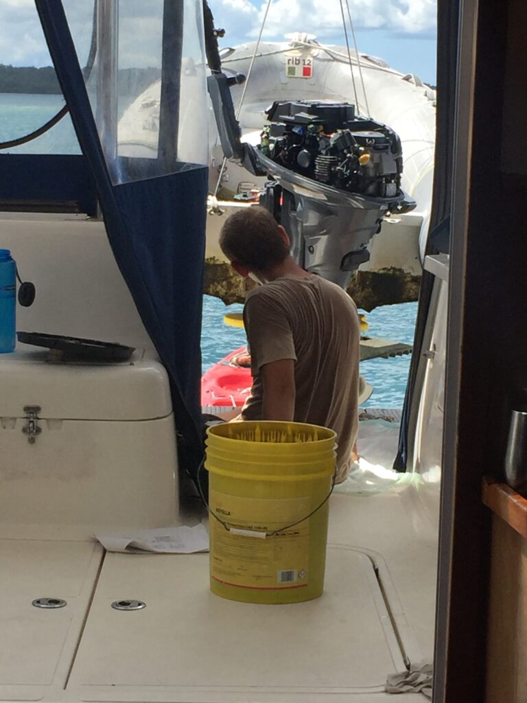 Paul age 15, servicing our Yamaha 25 HP dinghy engine
