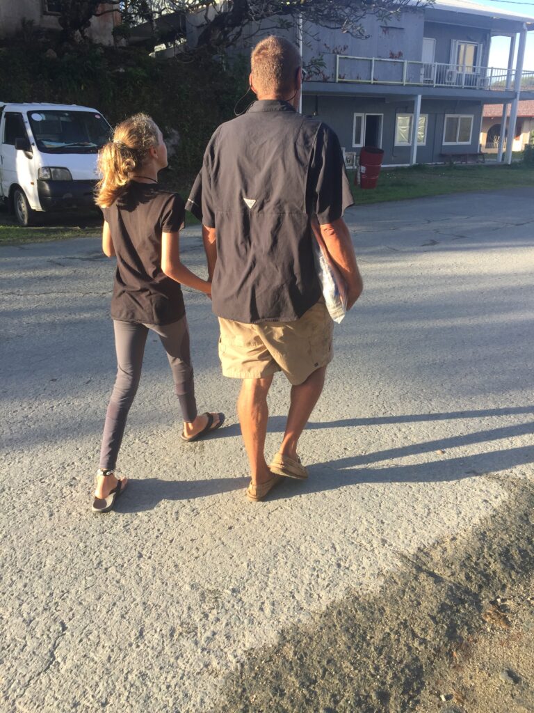 Karen and Rick walking with papers
