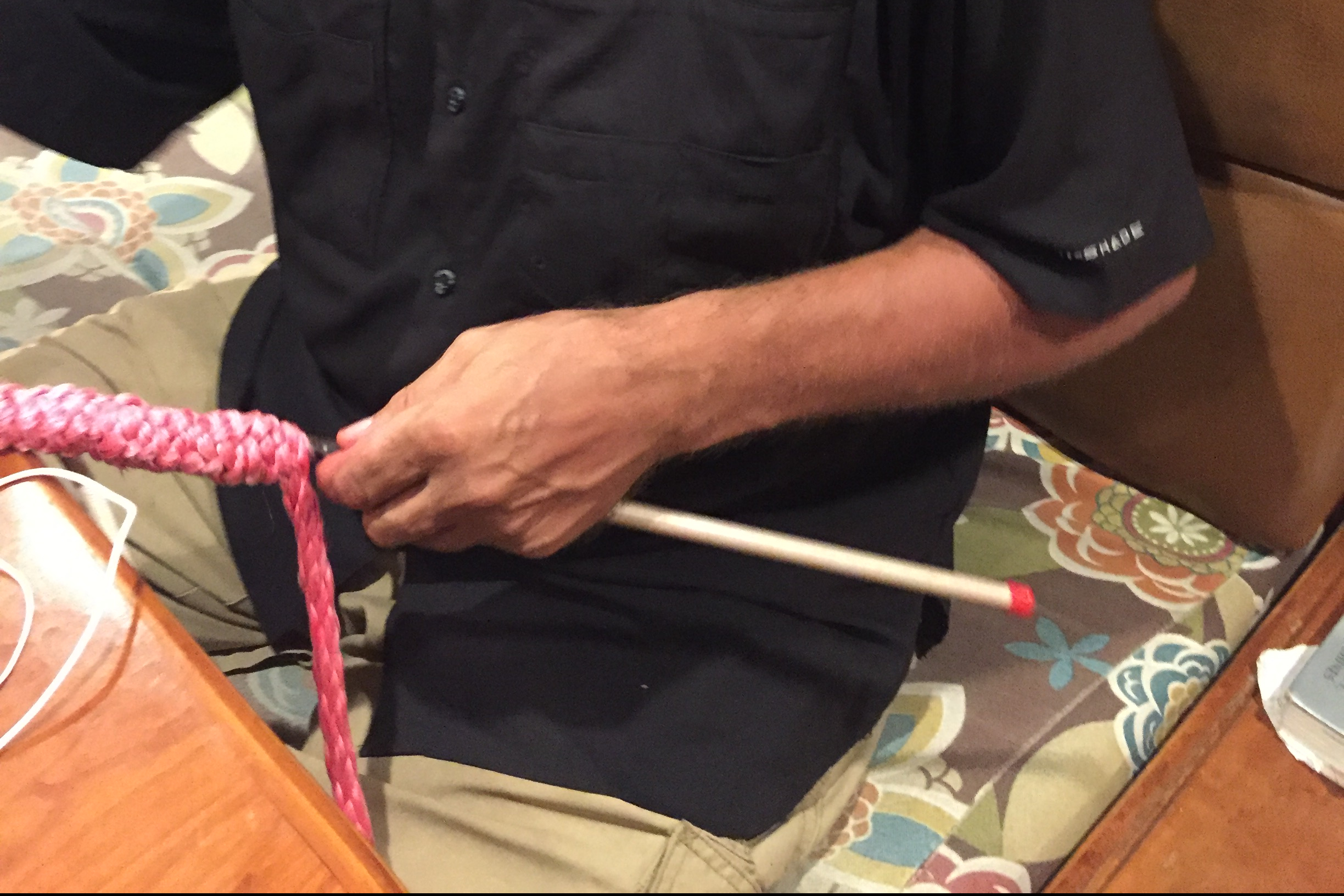 A knitting needle being used to splice a line.