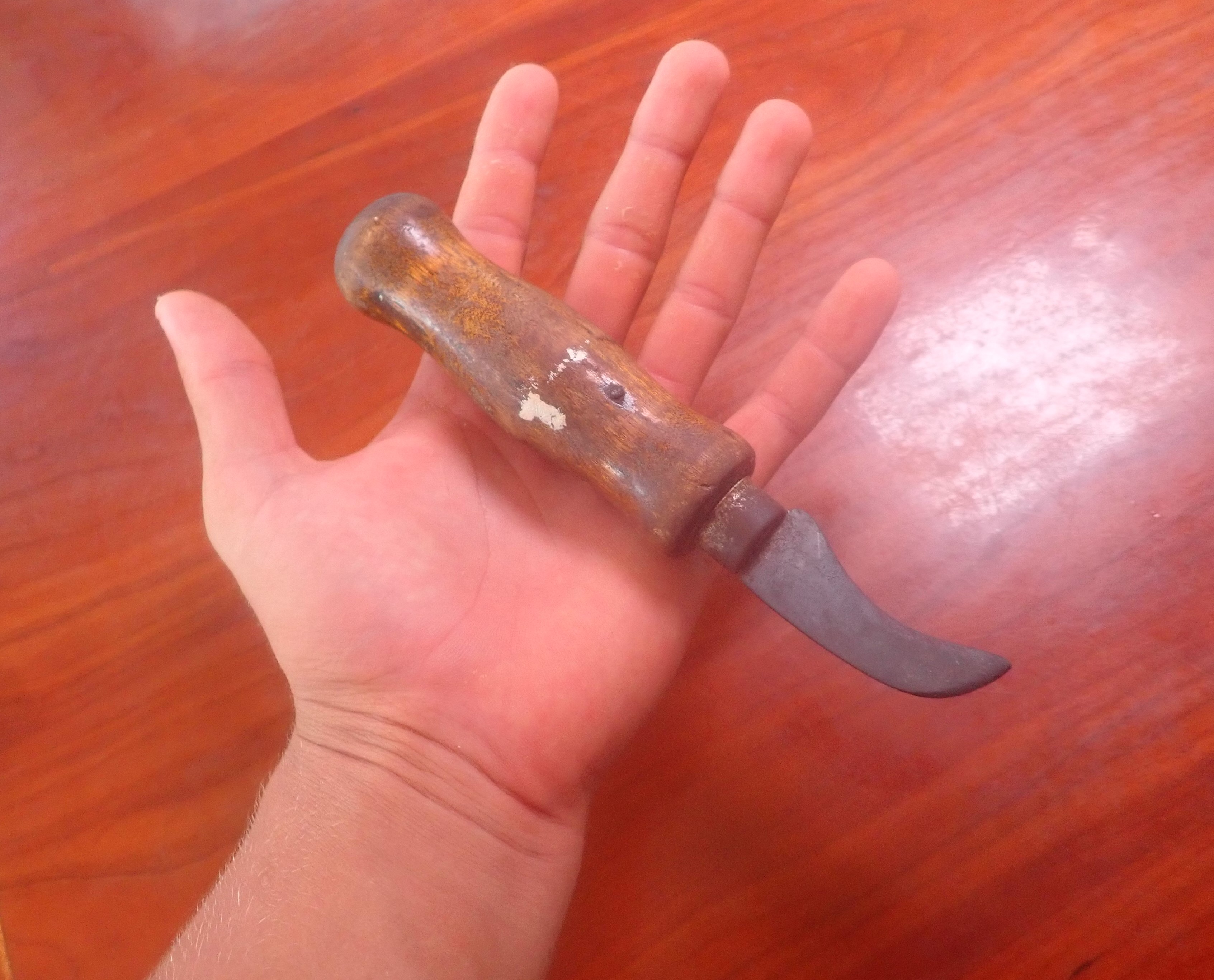 Paul holding Opa's knife in a sensible fashion