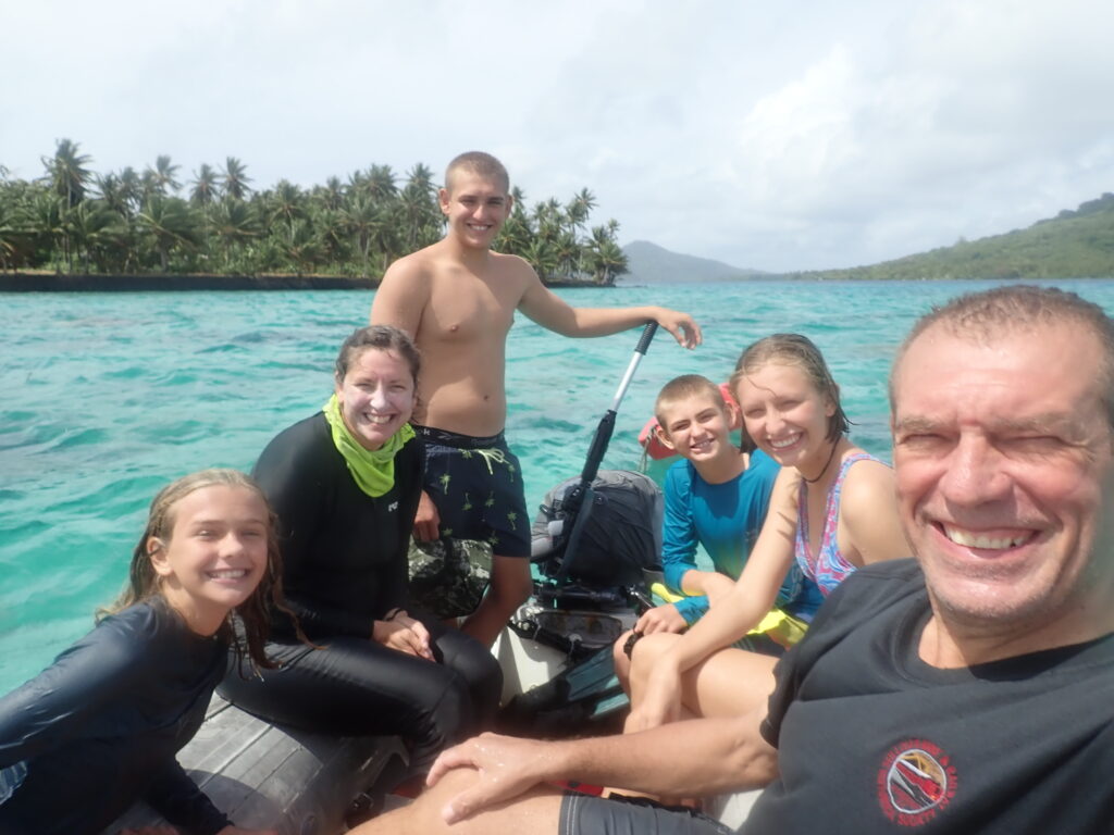 A picture of the Escher family in a dinghy