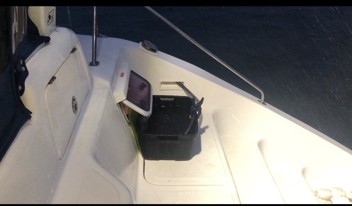 A Rubbermaid container to collect rainwater