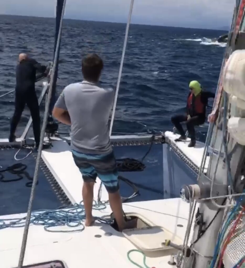 Diver Michael, Paul and Lorraine on the deck of St Francis catamaran, SV Aphrodite.