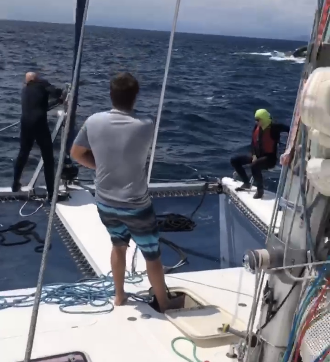 Diver Michael, Paul and Lorraine on the deck of St Francis catamaran, SV Aphrodite.