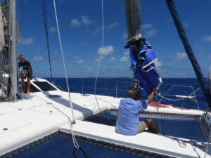 Putting the Parasailor back in the "sock" on SV Aphrodite, a St Francis 50 catamaran.