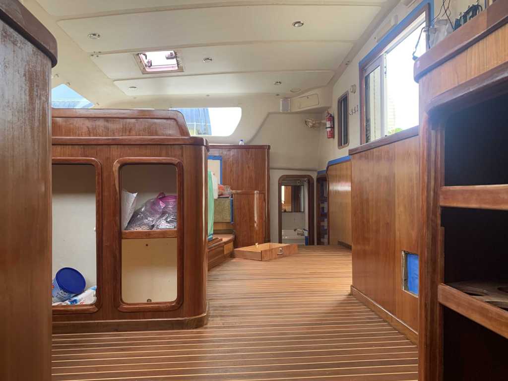 View of flooring in SV Aphrodite's saloon and nav station. The flooring is teak and holly supplied from Indonesia and installed by Eastbay Marine in Malaysia.