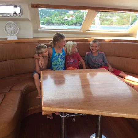 Photo of Escher kids on SV Aphrodite on the Ultraleather saloon cushions after slightly less than two years of use.