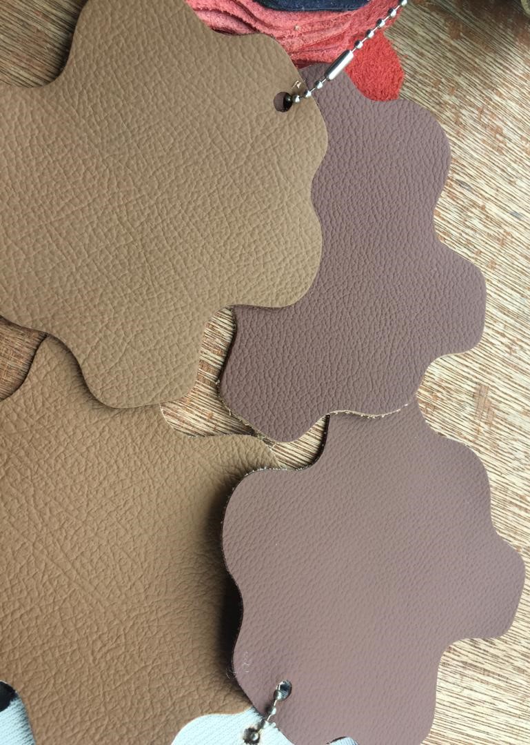Leather samples seen in different lighting appear much lighter and greyer.