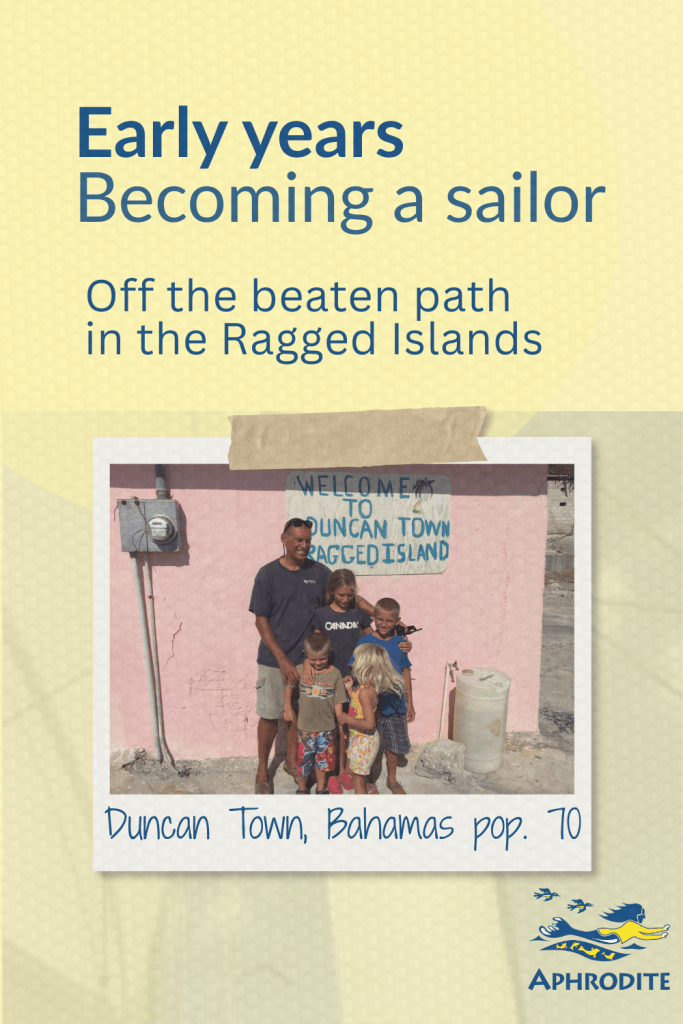 A photo of my husband, Rick Escher, and skipper of SV Aphrodite with our kids in Duncan Town, Bahamas which is part of the Ragged Island chain.