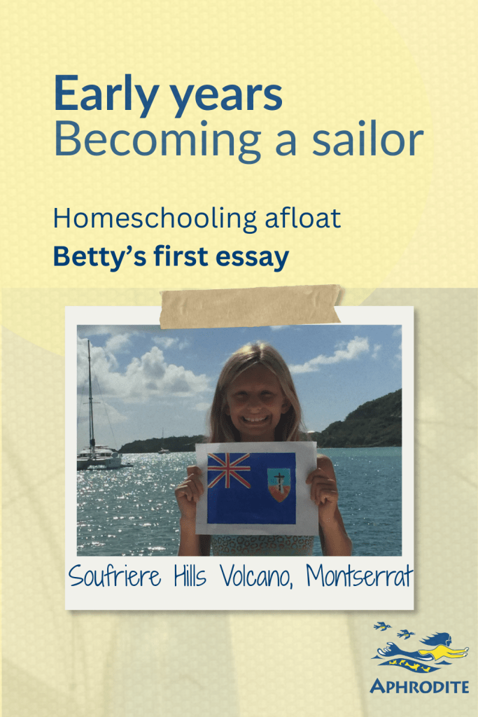 A photo of Betty with a hand-drawn flag of Montserrat that she made.