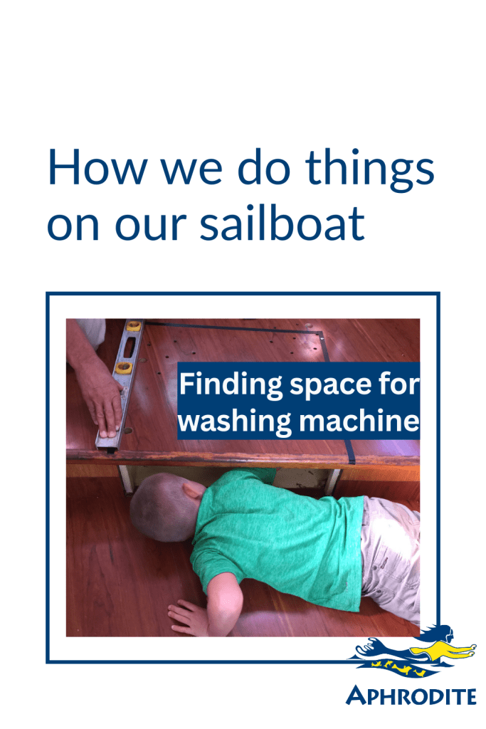 Henry looking at our in-floor chart drawer as possible place to locate space for our washing machine.