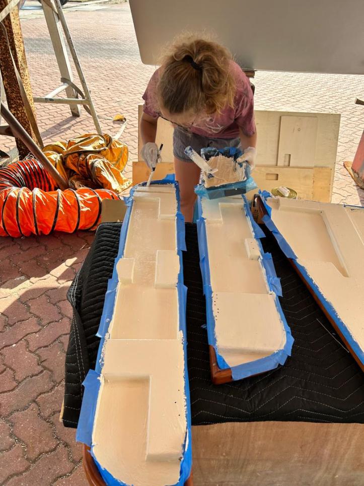 Karen painting the leaves of our saloon table