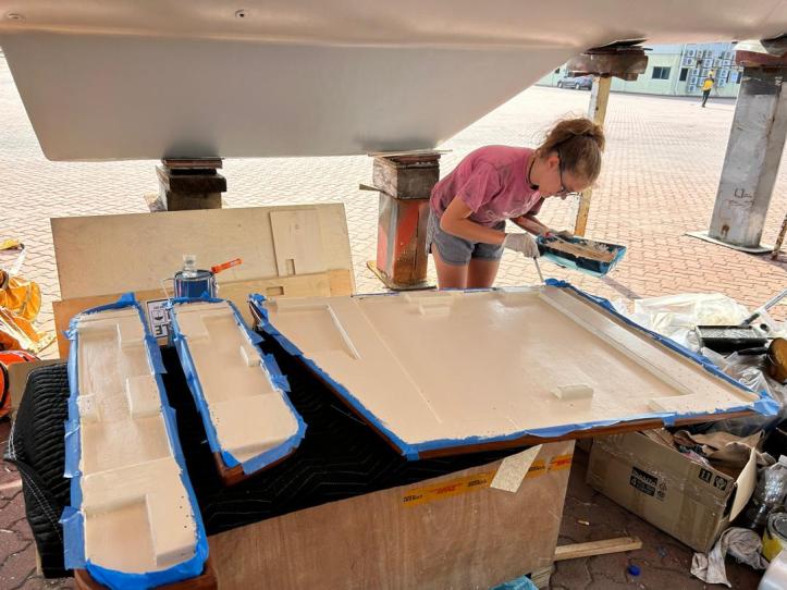 Karen painting our saloon table.