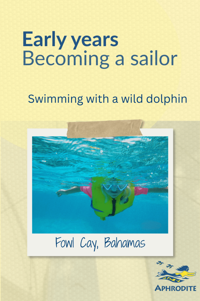 Karen swims at Fowl Cay, Bahamas with a solo wild dolphin.