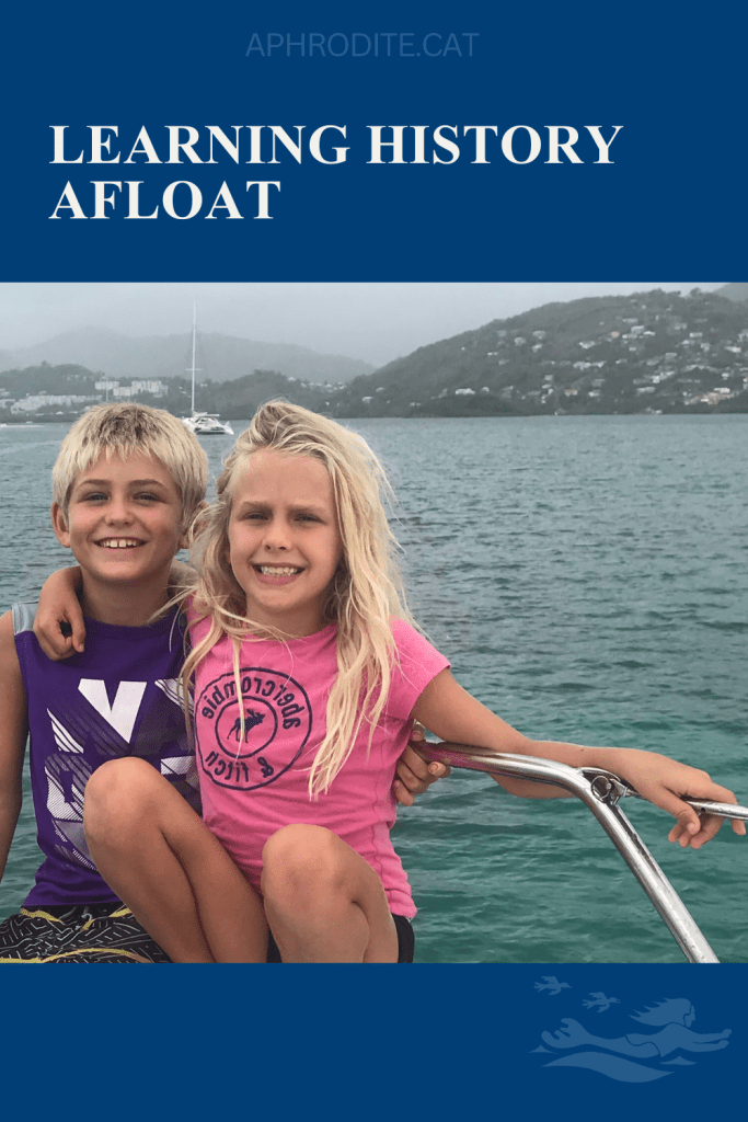 Karen and Henry in Martinique on the bow of our St. Francis 50 catamaran, SV Aphrodite.