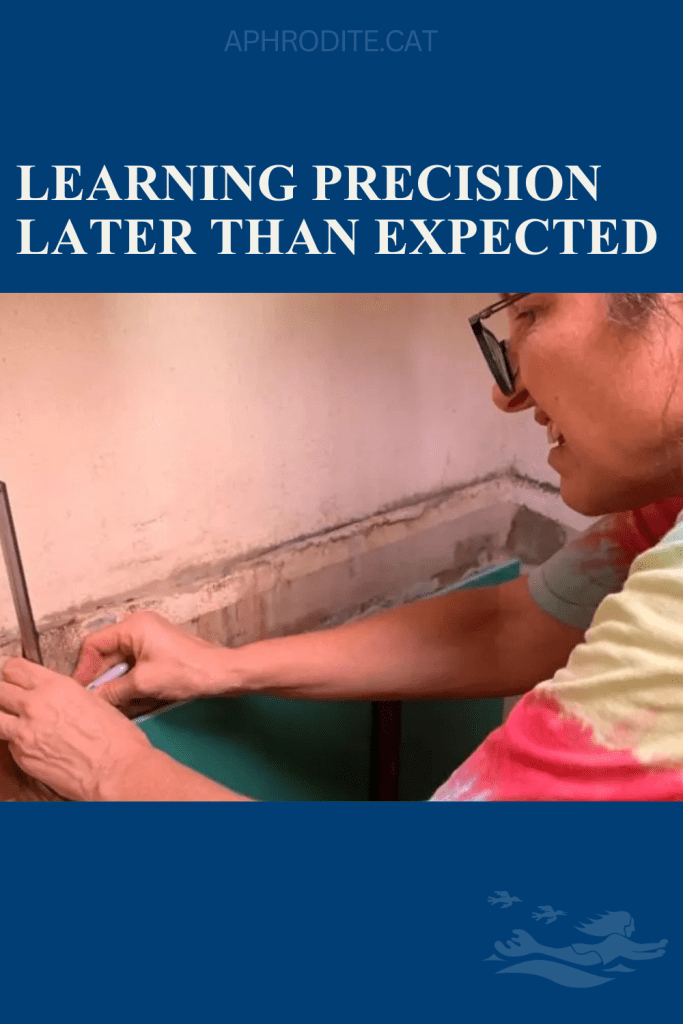 Lorraine looking frustrated and focused while measuring the curvature of our galley to communicate the fabrication of a new Corian countertop.