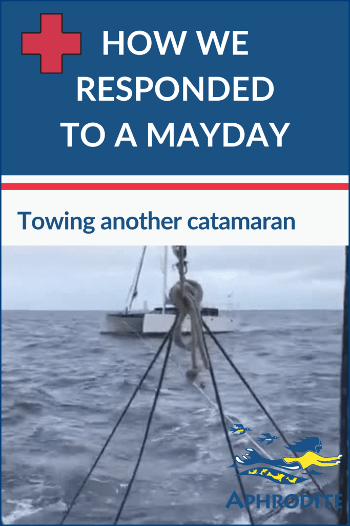 Shows SV Aphrodite, towing another catamaran on the way to Fiji during an emergency situation.