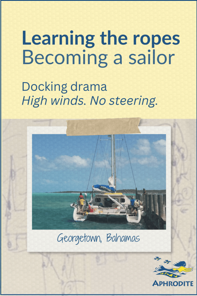 A photo of a catamaran trying to kedge themselves off a dock in Georgetown, Bahamas on a backdrop of a hand drawn docking plan, which was done by my husband, Rick Escher.