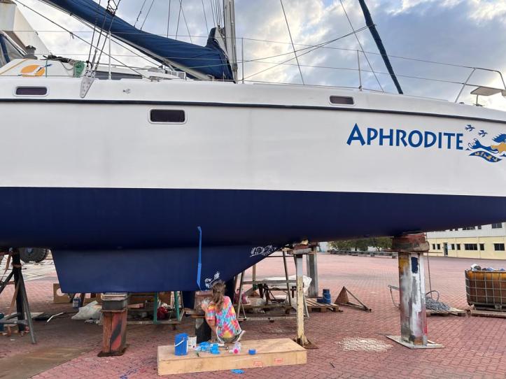 Starboard keel at the start of the project when Karen began painting the classical scrollwork on our St. Francis 50 catamaran.