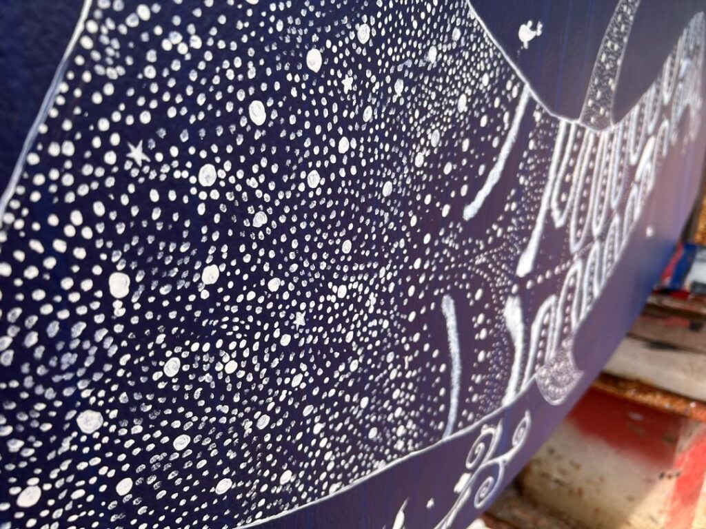 Sailboat keel painting: Close up of the spots on the whale shark that Karen painted on the keel of our catamaran.