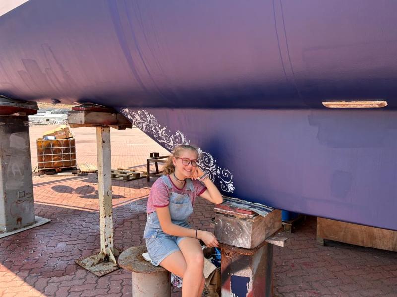 Karen paints our keel. An artist’s challenges are not what I would have expected.