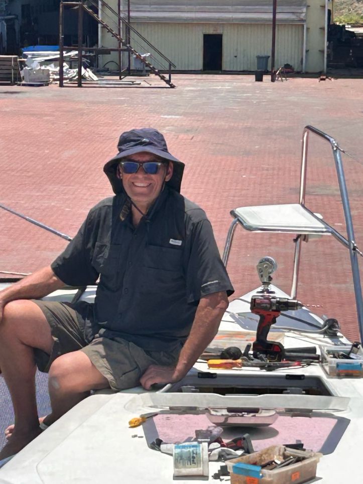 Rick with our starboard Lewmar hatch that we rebedded during our refit at the Lunas Shipyard in Langkawi