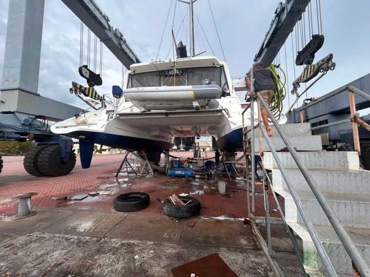 SV Aphrodite is hoisted in slings at Lunas Shipyard Langkawi