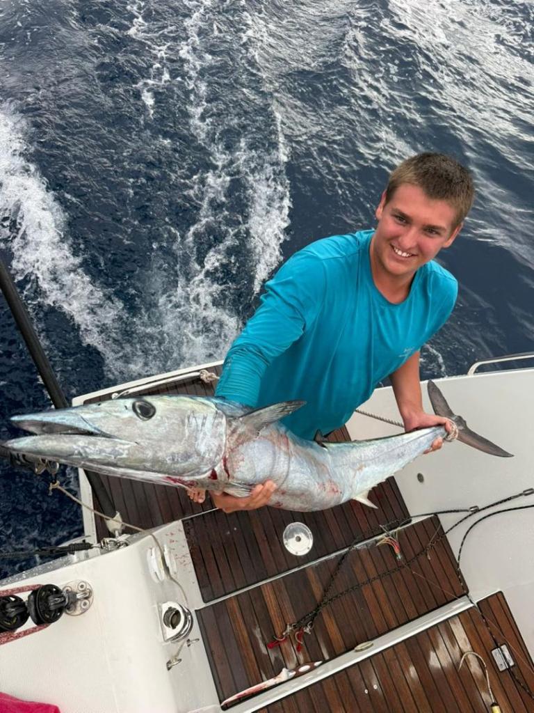 Paul with a Wahoo caught on the Pacific Crossing when he was crewing on SV O'Vive